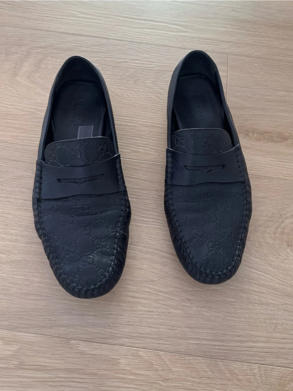 Gucci Black GG Embossed Leather Penny Loafers